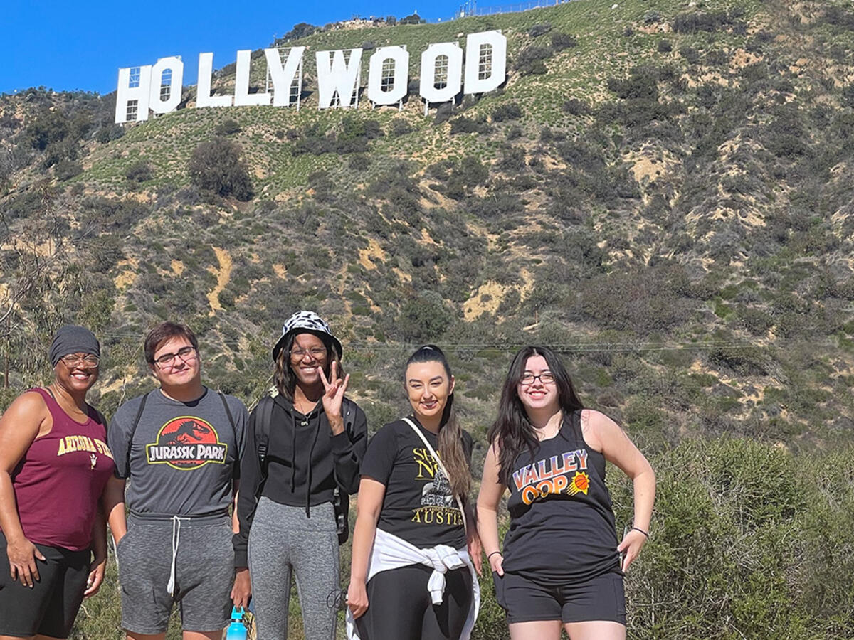 Students in front of Hollywood sign